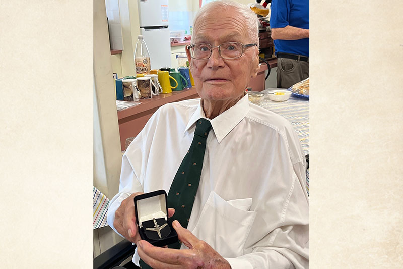 veteran Eric Geldard with their medal