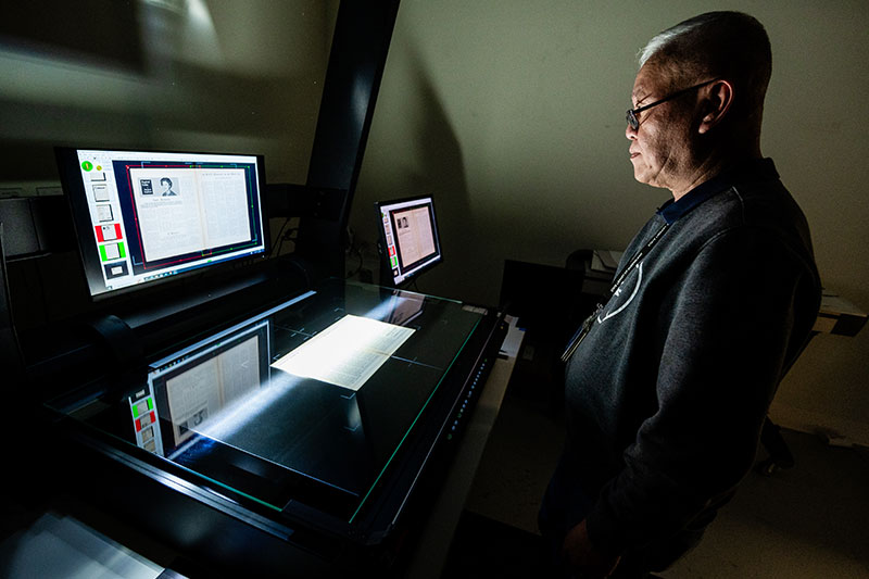 person scanning RSL magazine