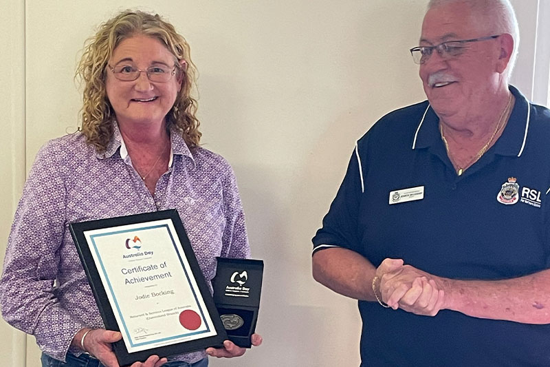 Jodie Bocking being presented an Australia Day Medallion by Far Northern RSL District President Ken Willoughby